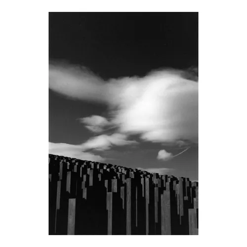 Pillars Under Heavy Skies